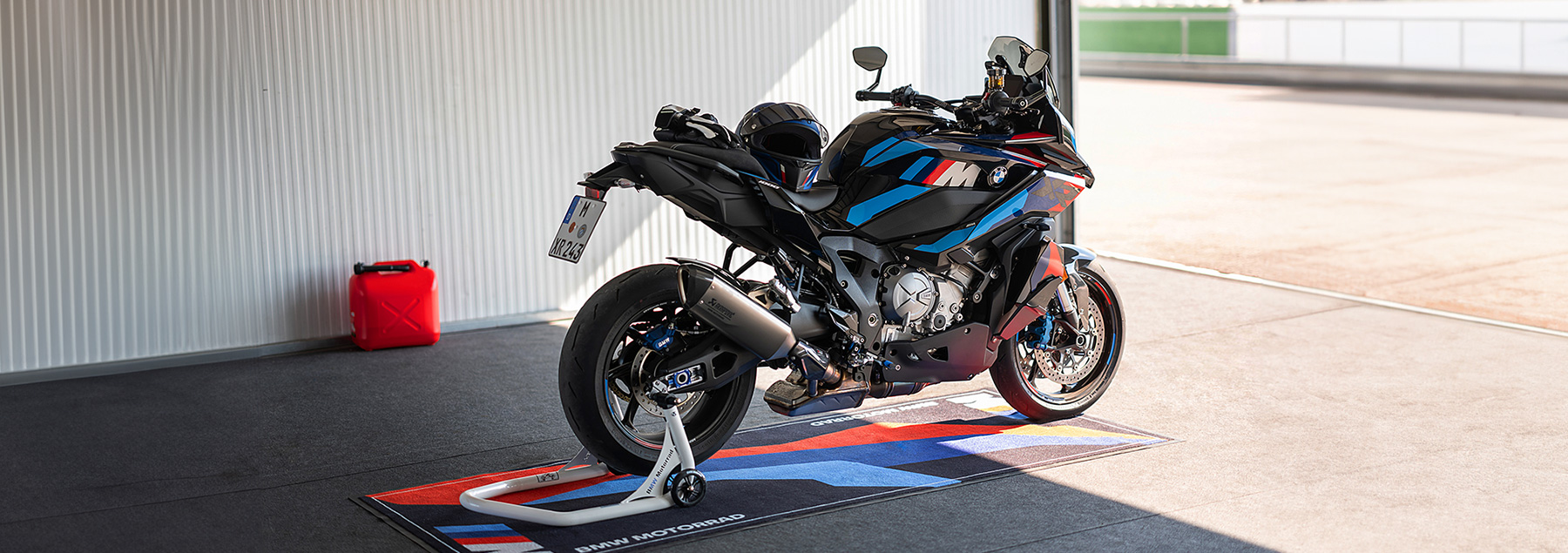 A BMW M 1000 XR standing in a building. 