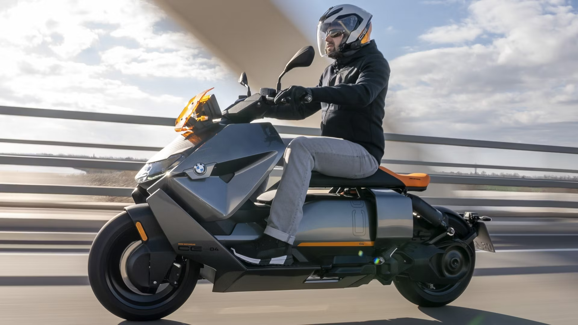 A BMW CE 04 riding down a highway in Riverside, CA.